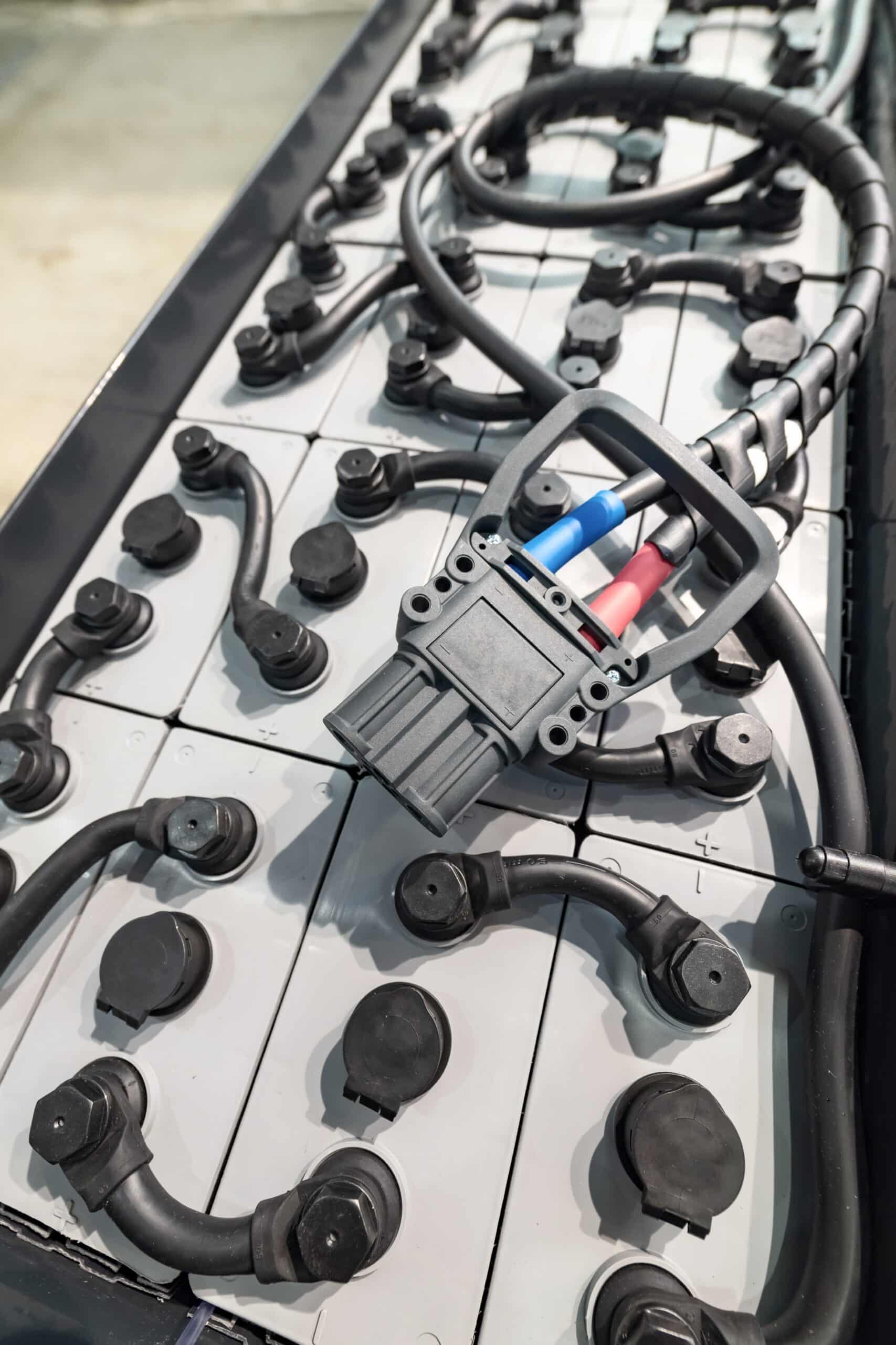 Powerful rechargeable battery forklift. On the surface of the battery is an electrical connector.