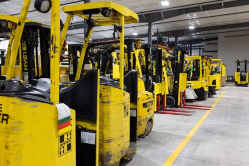 Used forklift in warehouse ready for material handling operations
